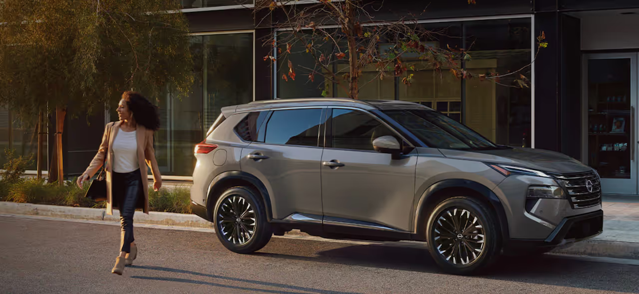 Customer and salesperson shaking hands at Patterson Nissan Longview after successful trade-in